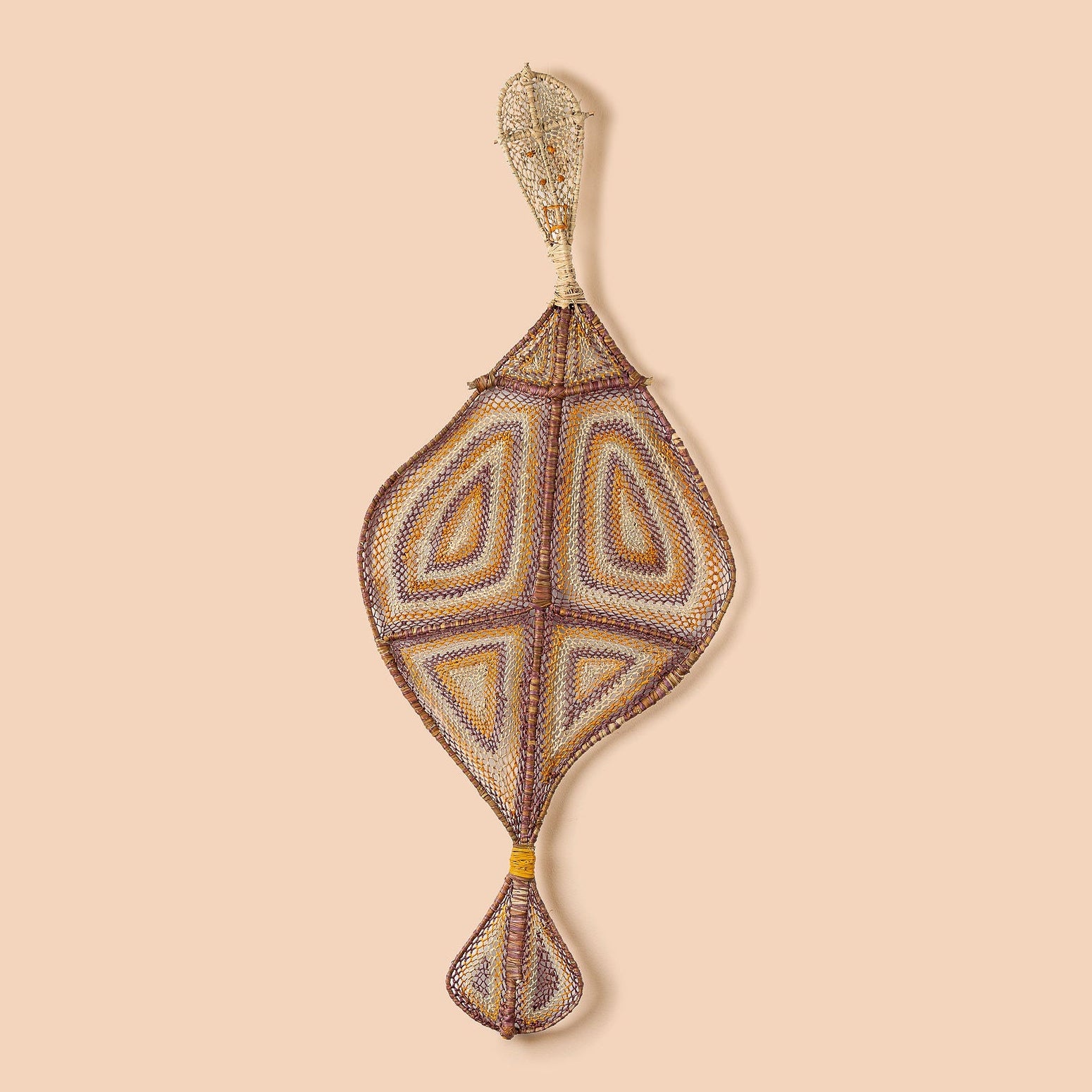 A handwoven artwork piece featuring geometric patterns, predominantly in earthy tones, symbolizing the Yawkyawk.