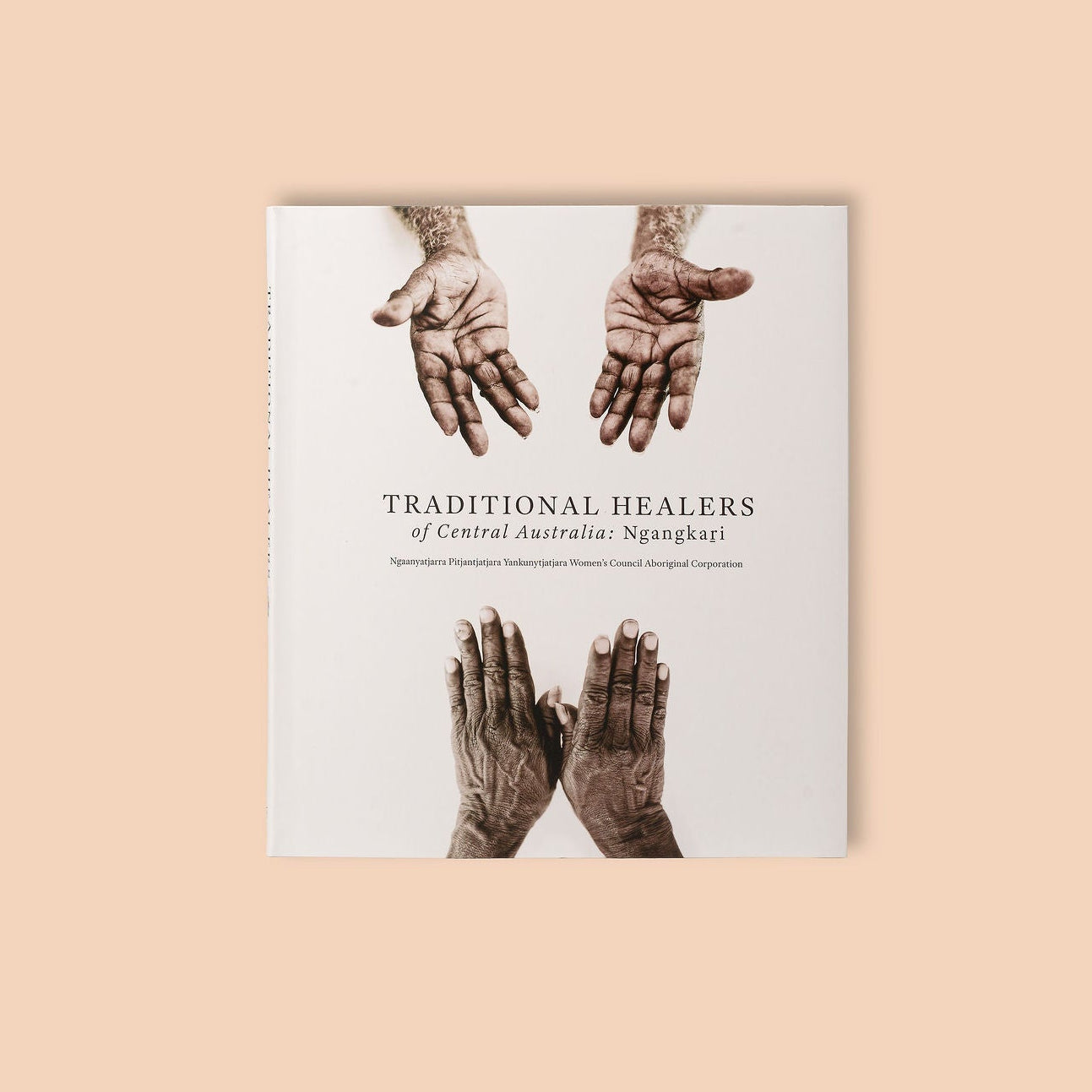Book cover with images of hands and text 'Traditional Healers of Central Australia, Ngangguri' on a beige background