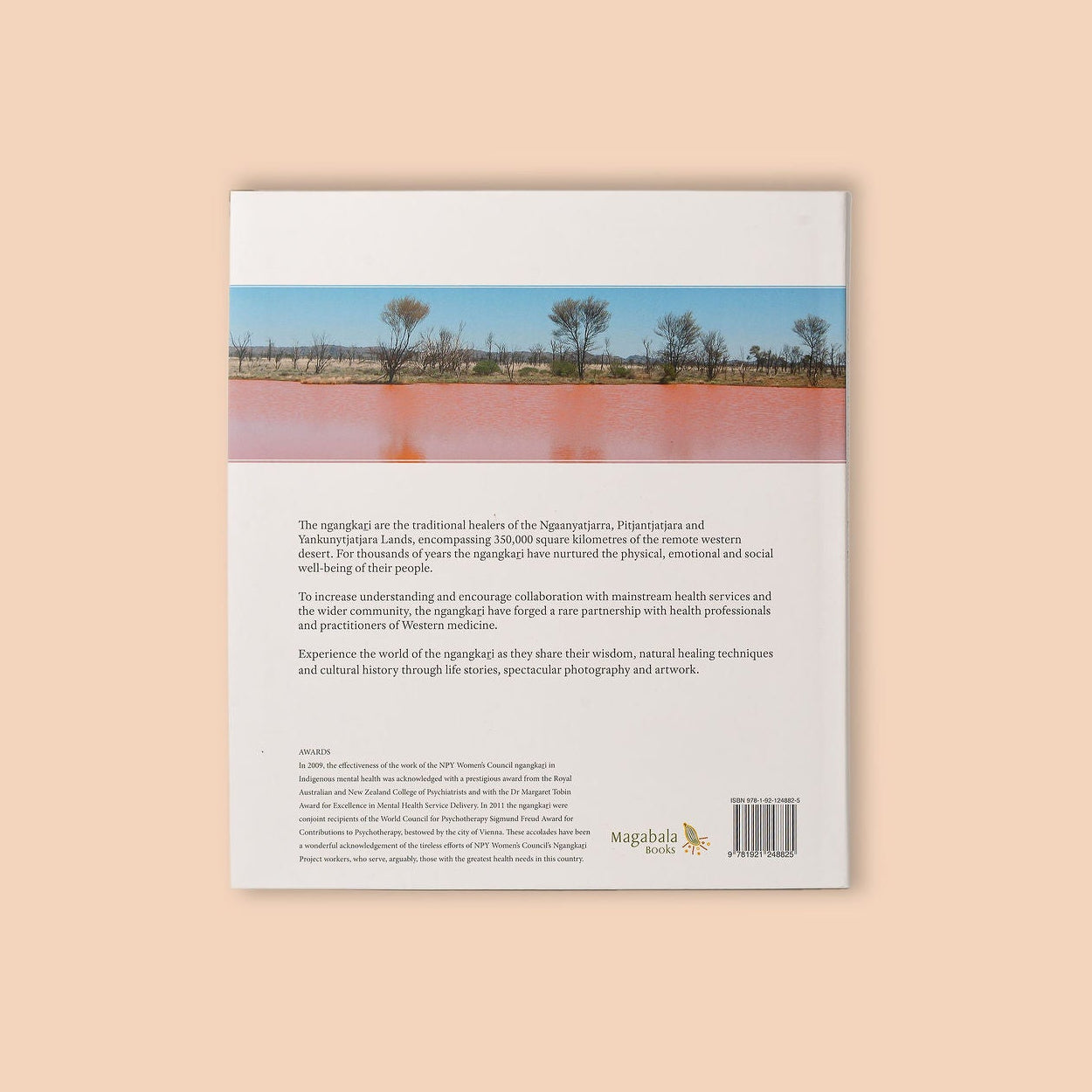 Book cover with a scenic photograph of a lake and trees on a beige background